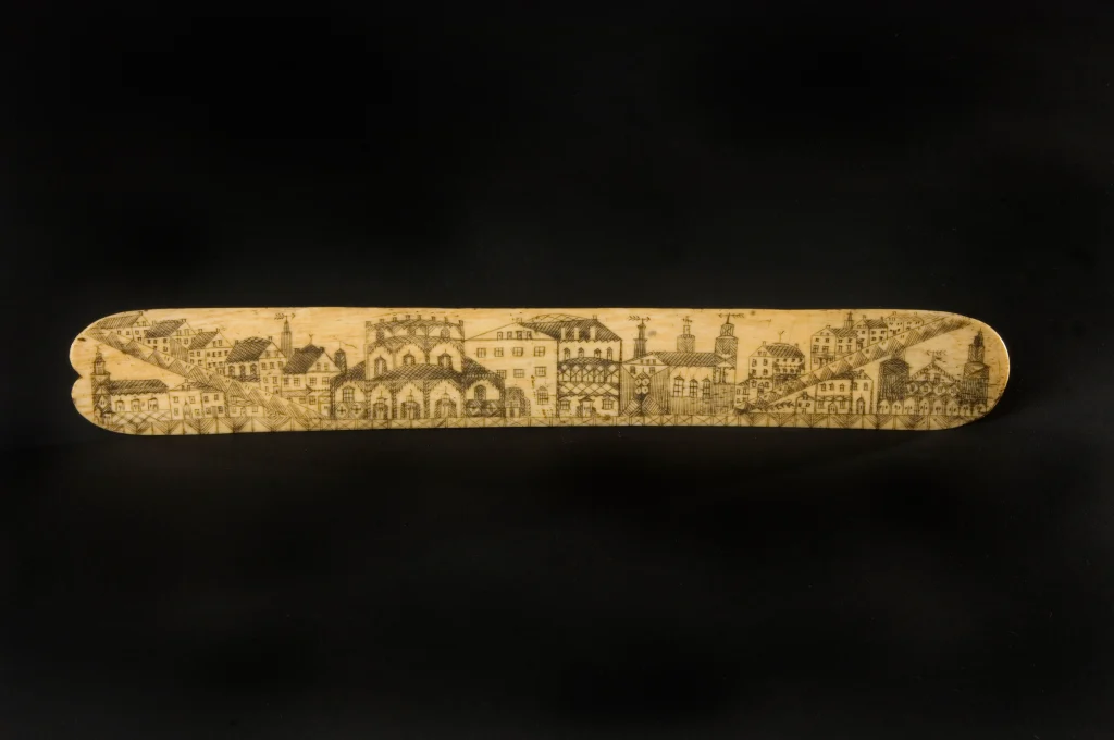 Mid-19th-century carved bone corset busk used as a removable stiffener